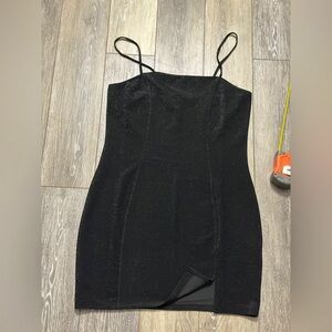Elegant Black mini dress with shimmer effect to it Size Large